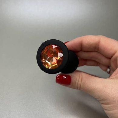 Силіконова анальна пробка - чорна з помаранчевим кристалом (2,8 см) - фото