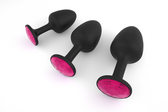 Анальная пробка с красными кристаллом Dorcel M (3,2 см) со смещенным центром тяжести - фото