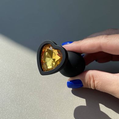 Силиконовая анальная пробка сердечко - черная с оранжевым кристаллом (2,8 см) - фото